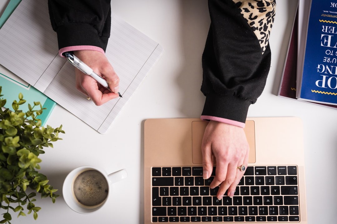 writer at desk with notebook