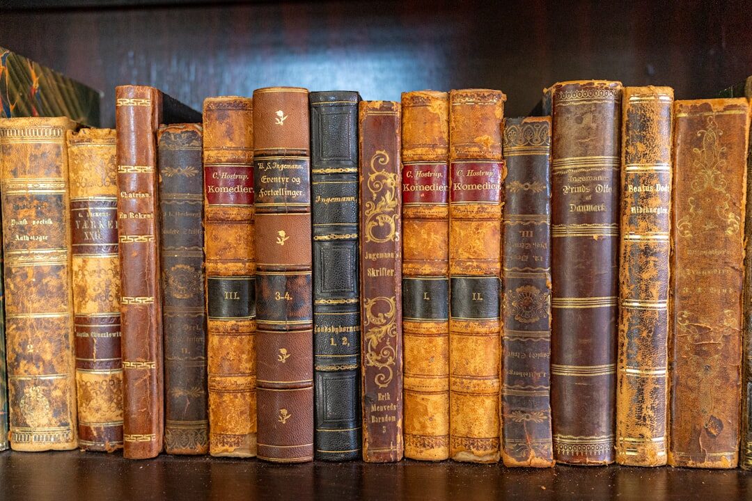 Antique bookshelf with old leather-bound books and a magnifying glass