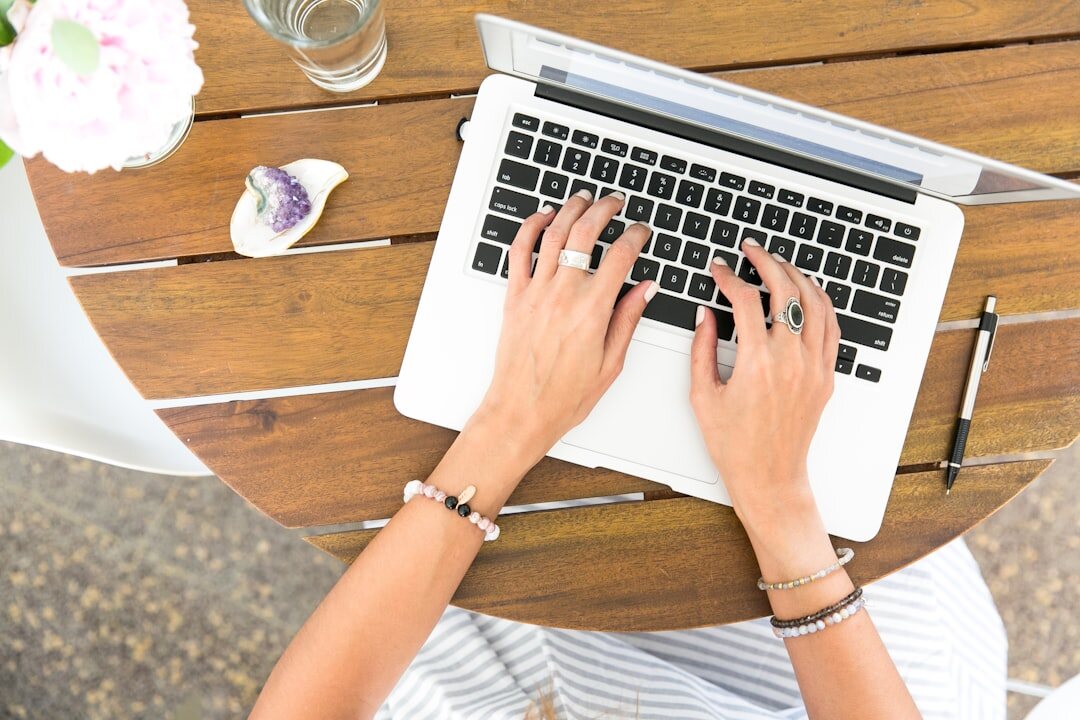mystery writer typing dialogue on laptop