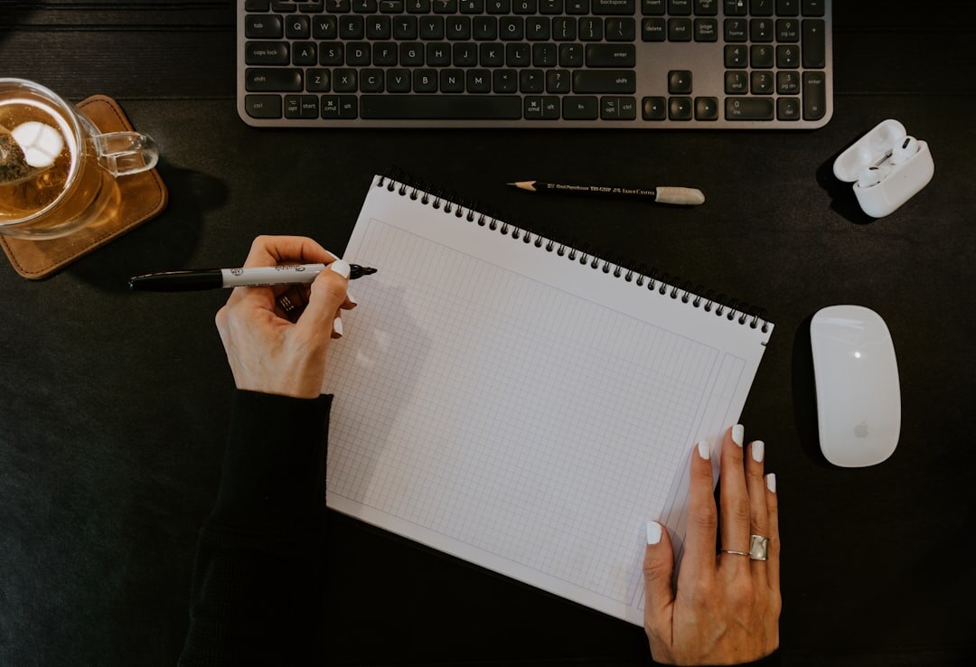 writer at desk with notebook